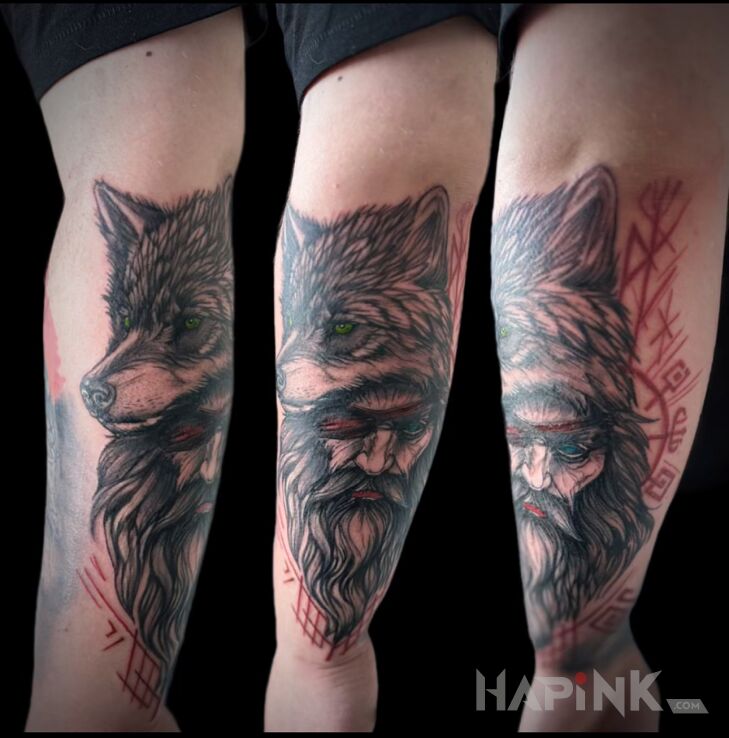 Tattoo Odin with Wolf in faces motif and realistic style on the forearm