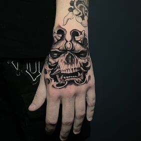 Tattoo Samurai skull on the hand motif: dark style: graphic / illustrative