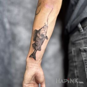 Tattoo Perch on the forearm motif: black and gray style: graphic / illustrative