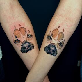 Tattoo Paw prints with enclosed portraits On the arm motif: colorful style: realistic