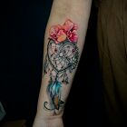 Dreamcatcher with flowers and feathers