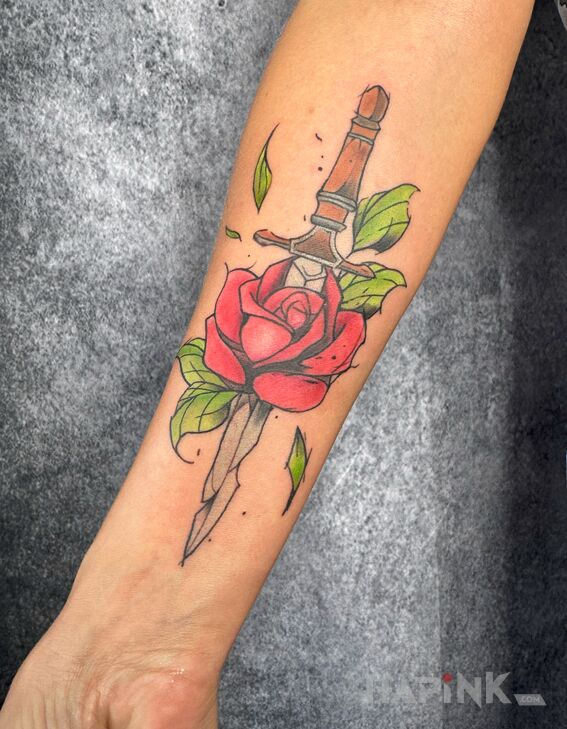Tattoo Rose Pierced by a Dagger in colorful motif and graphic / illustrative style On the arm