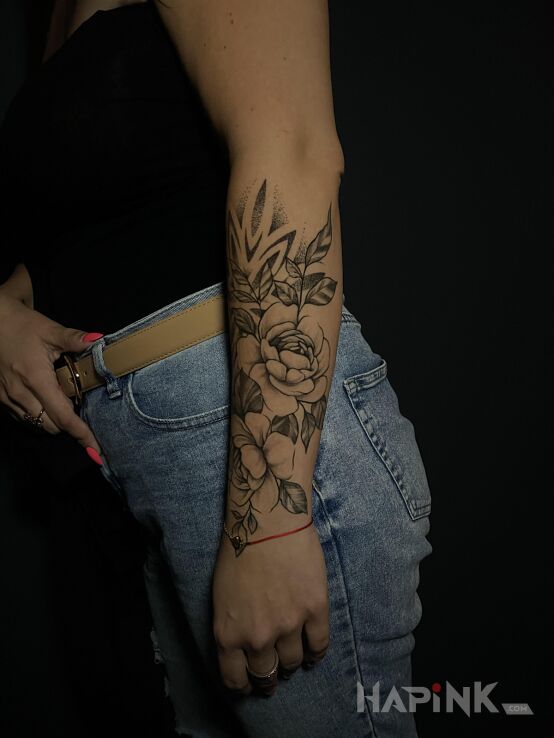 Tattoo Flowers with Mandala in black and gray motif and dotwork style on the forearm