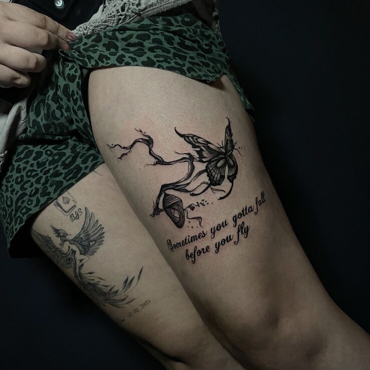 Tattoo Cocoon on a branch and a flying butterfly in animals motif and calligraphy style on the thigh