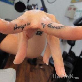 Tattoo Always in my heart on the fingers motif: lettering