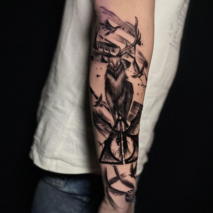 Tattoo Harry Potter Stag in black and gray motif and graphic / illustrative style on the forearm