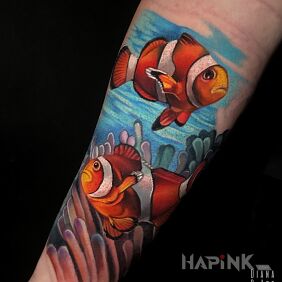 Tattoo Marine vibe, clownfish On the arm motif: colorful style: realistic