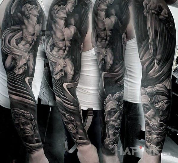 Tattoo Bogowie (chyba) in faces motif on the forearm