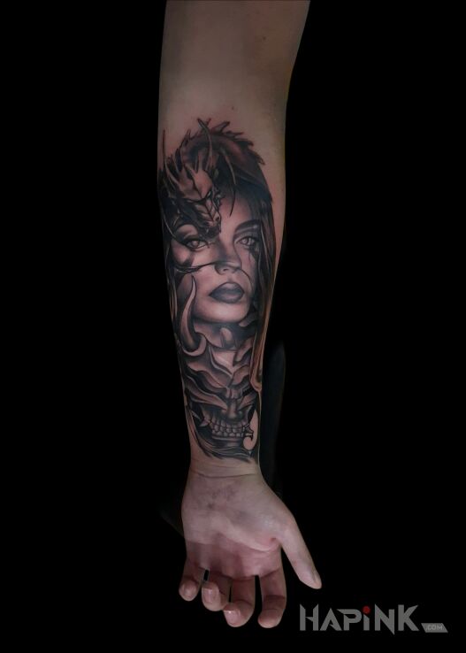 Tattoo 1 session - female portrait with a dragon in faces motif and realistic style On the arm