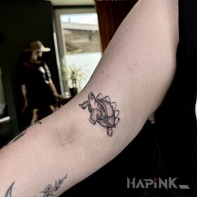 Tattoo Little Turtle on the bicep motif: animals style: graphic / illustrative