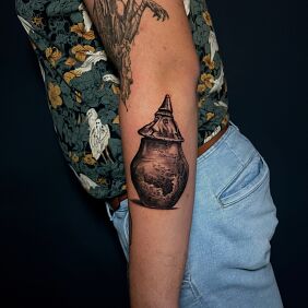 Tattoo Funerary urn face archaeology On the arm motif: objects style: graphic / illustrative