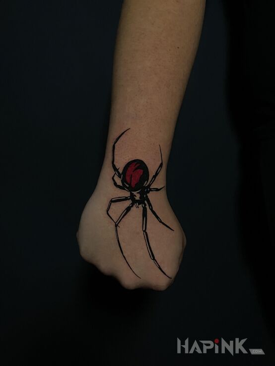 Tattoo Spider crawling on the hand in animals motif and graphic / illustrative style on the hand