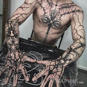 Tattoo Tangled in Black on the forearm motif: black and gray style: blackwork / blackout