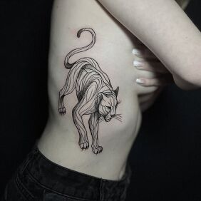 Tattoo Puma with a line on the side on the ribs motif: animals style: contour / linework