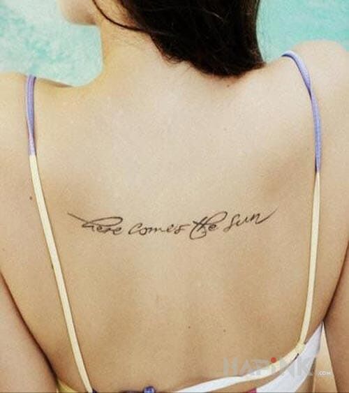 Tattoo Here comes the sun in lettering motif on the back