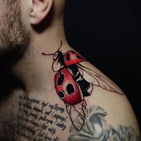 Tattoo Ladybug in color on the shoulder motif: insects style: cartoon / comic book