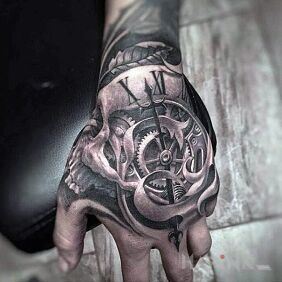 Tattoo Clock on the hand motif: skulls style: realistic