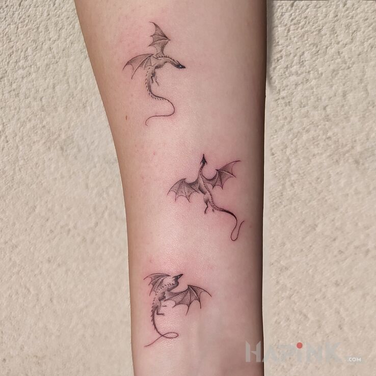 Tattoo Micro artwork - the size of one dragon is about 2 cm in graphic / illustrative style On the arm
