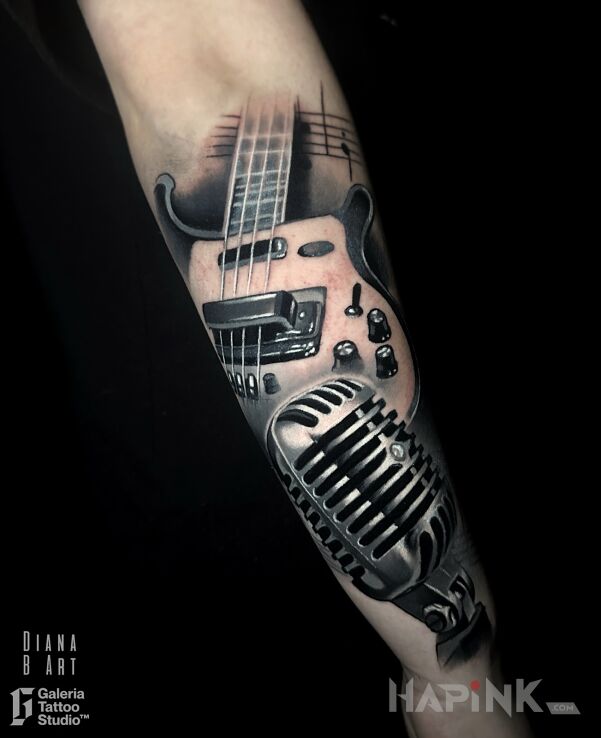 Tattoo Realistic music theme in objects motif and realistic style On the arm