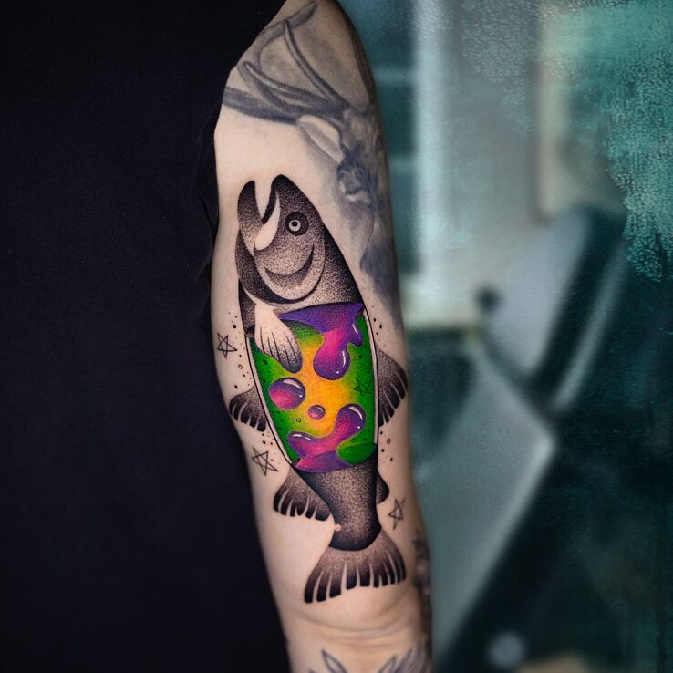 Tattoo ✨🐟 A Fish Carrying Its Own Universe Within! 🐟✨ in animals motif and newschool style on the bicep