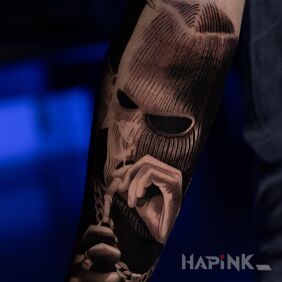 Tattoo Gangster smoking a pipe On the arm motif: characters style: realistic