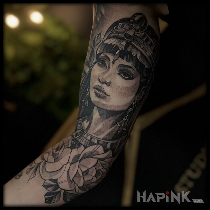 Tattoo Cleopatra in flowers motif and graphic / illustrative style On the arm