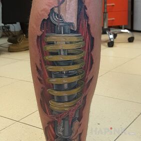 Tattoo Biomechanics on the calf motif: anatomical style: realistic