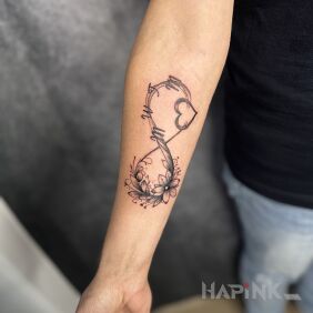 Tattoo Infinity symbol On the arm motif: flowers style: graphic / illustrative
