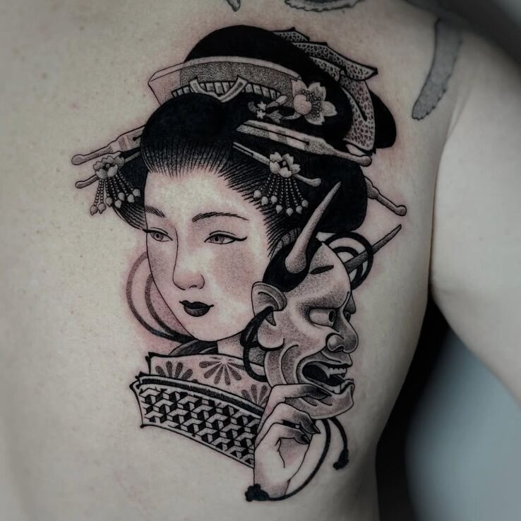Tattoo Geisha with Hannya Mask in faces motif and graphic / illustrative style on the shoulder blades