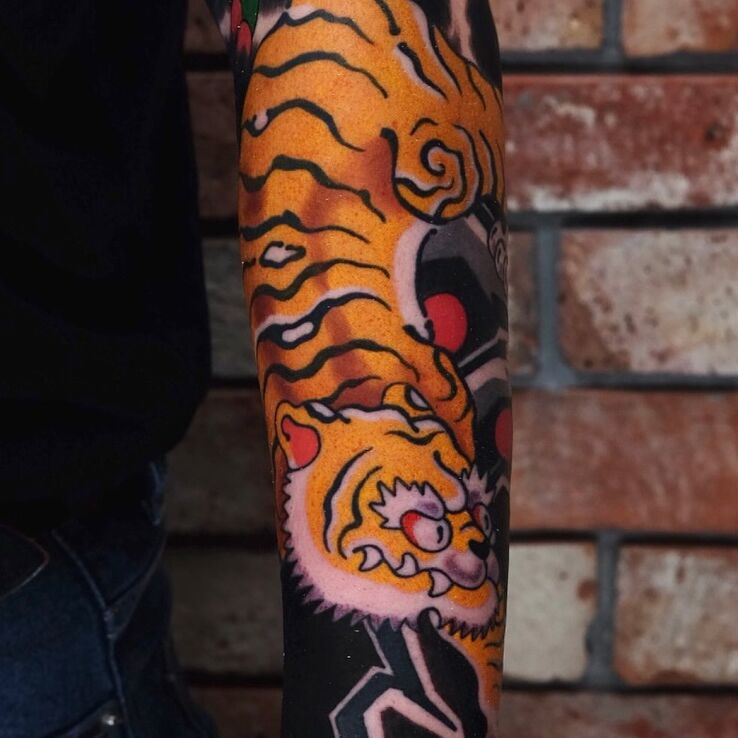 Tattoo Tiger in Japanese style in colorful motif and japanese / irezumi style On the arm