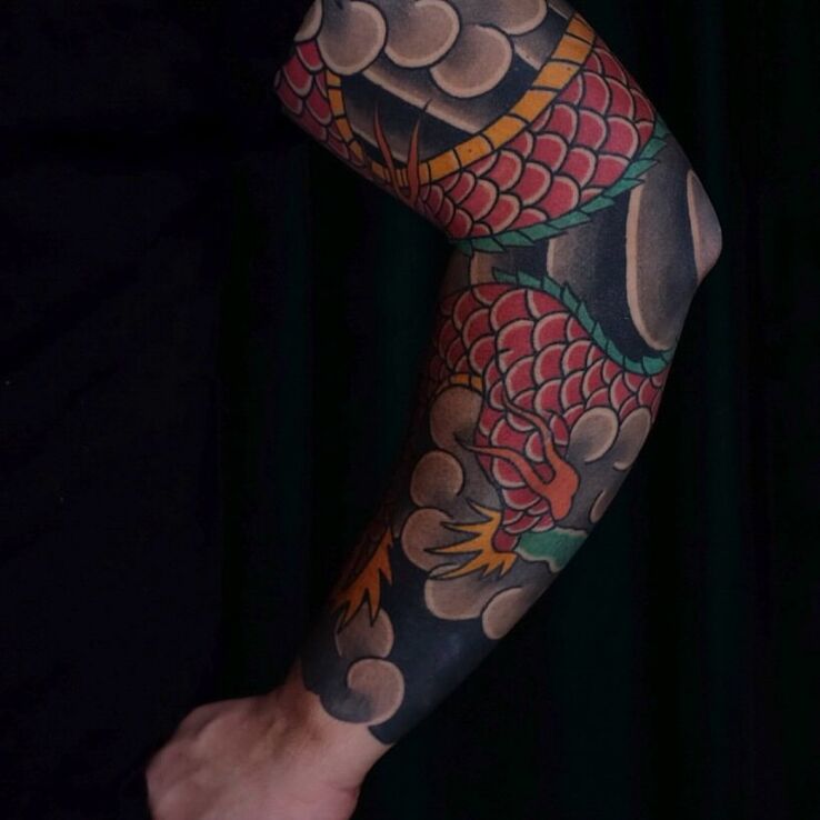 Tattoo Dragon in the Clouds in sleeves motif and japanese / irezumi style on the elbow