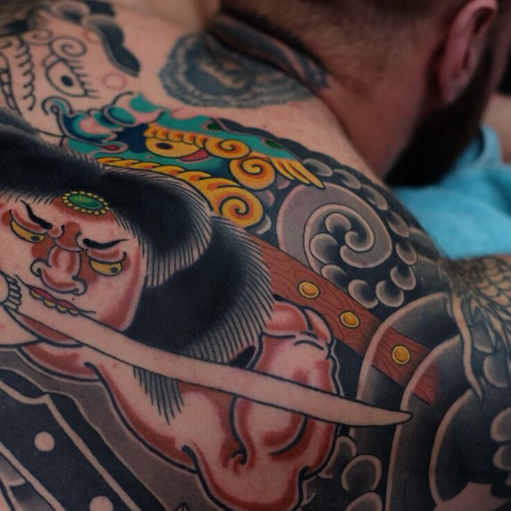 Tattoo Warrior with a sword in characters motif and japanese / irezumi style on the back