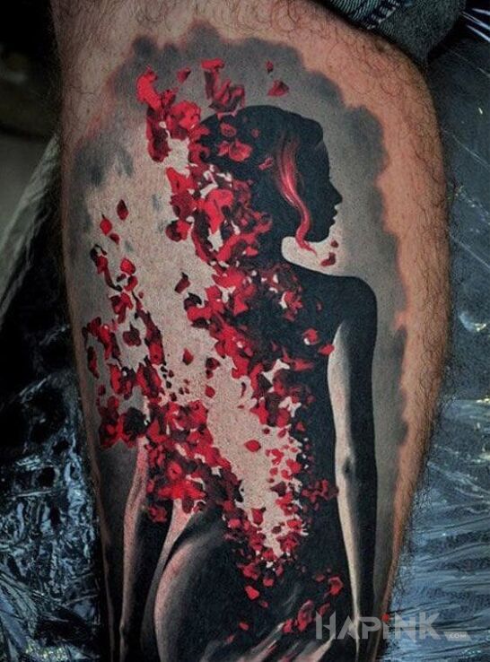 Tattoo Sylwetka kobiety in characters motif on the calf