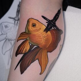 Tattoo Goldfish with a Dagger on the calf motif: colorful style: neo-traditional