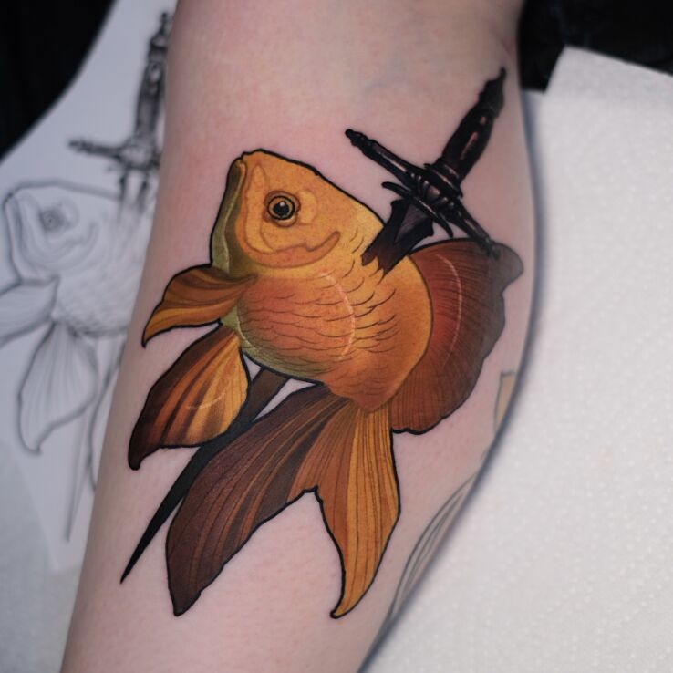 Tattoo Goldfish with a Dagger in animals motif and neo-traditional style on the leg