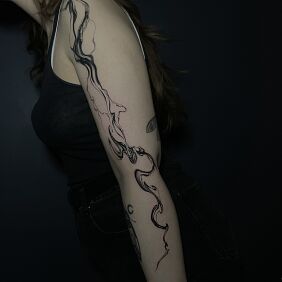 Tattoo Black and gray abstraction on the forearm motif: black and gray style: abstract