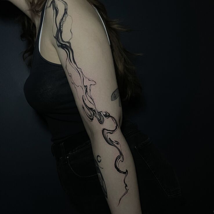 Tattoo Black and gray abstraction in other motif and abstract style on the upper arm
