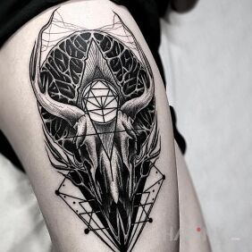 Tattoo Goat's head on the leg motif: skulls