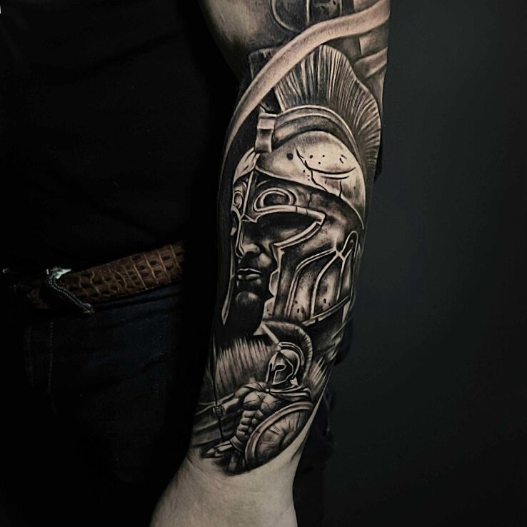 Tattoo Warrior Legionary in black and gray motif and realistic style on the forearm