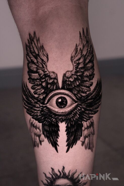 Tattoo Seraph in religious motif and realistic style on the calf