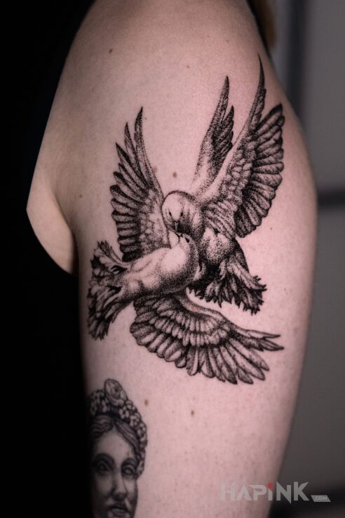 Tattoo Doves:) in animals motif and realistic style On the arm