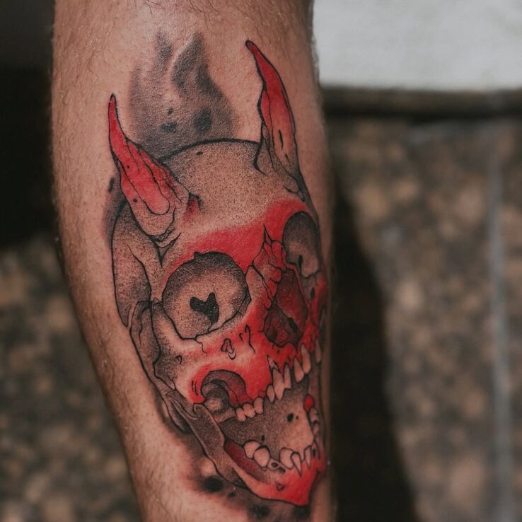 Tattoo Skull in Red in dark motif and dotwork style on the calf