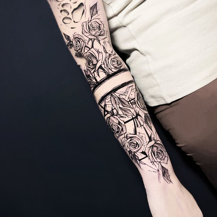 Tattoo Sketch roses divided by a band in sketch style on the upper arm