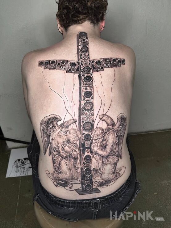 Tattoo Sacred Music in religious motif and graphic / illustrative style on the back