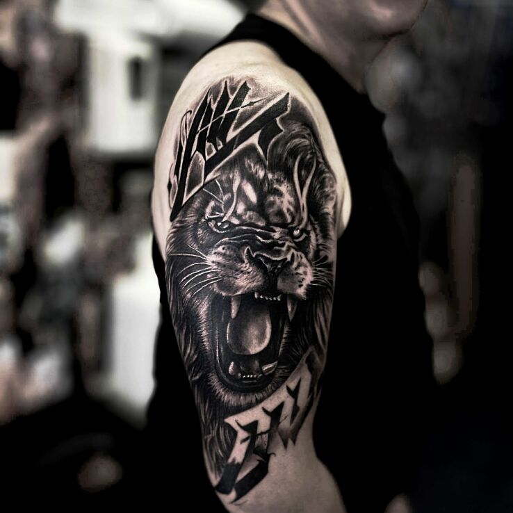 Tattoo Lion and its Roar in animals motif and realistic style On the arm