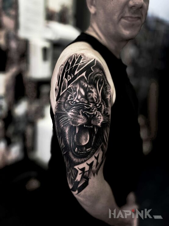 Tattoo Lion and its Roar in animals motif and realistic style On the arm