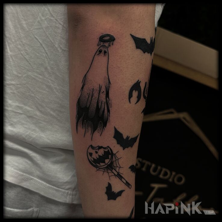 Tattoo Halloween vibe in demons motif and graphic / illustrative style on the forearm