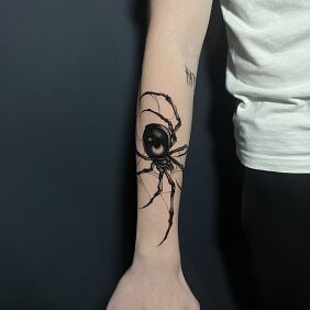 Tattoo Black Spider On the arm motif: black and gray style: realistic