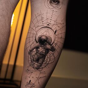 Tattoo Astronaut and Eye - Surrealistic Space Tattoo on the calf motif: characters style: geometric