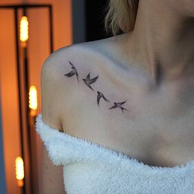 Tattoo Small Birds Flying on the Collarbone on the collarbone motif: animals style: graphic / illustrative